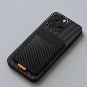 Black magnetic carbon fiber card wallet stand attached to an iPhone case