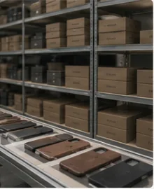 Warehouse inventory shelves for packaged phone case products